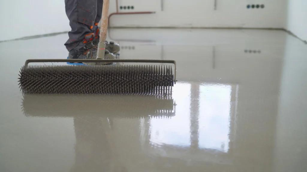 ndustrial protective floor coating being applied to a facility surface to ensure adhesion, film integrity, and long-term durability under operational conditions.