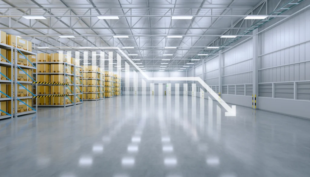 Industrial warehouse interior illustrating how outdated protective coating systems can contribute to increased operational and compliance costs over time.