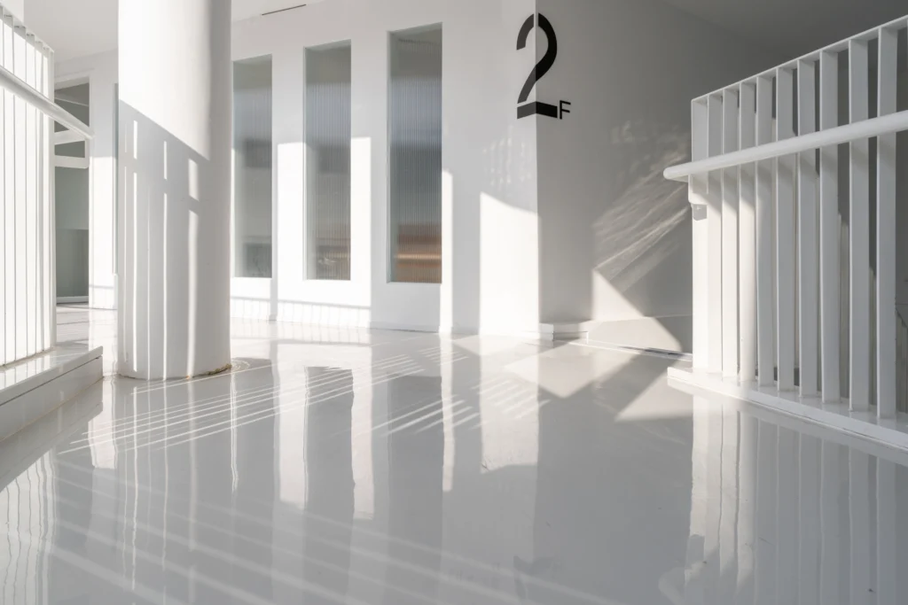 High-gloss urethane coated floor in a modern commercial stairwell